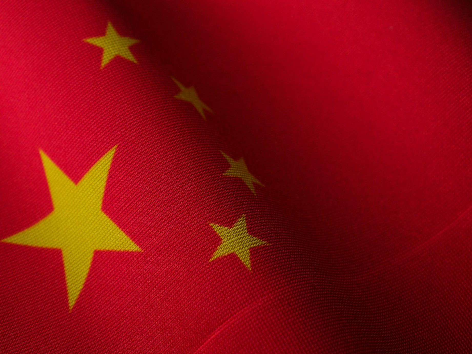 Flag of China as leading AI chatbots including OpenAI's ChatGPT, Microsoft's Copilot, Google's Gemini, DeepSeek's R1, and xAI's Grok are caught reproducing Chinese Communist Party (CCP) propaganda and censorship when questioned on sensitive topics.